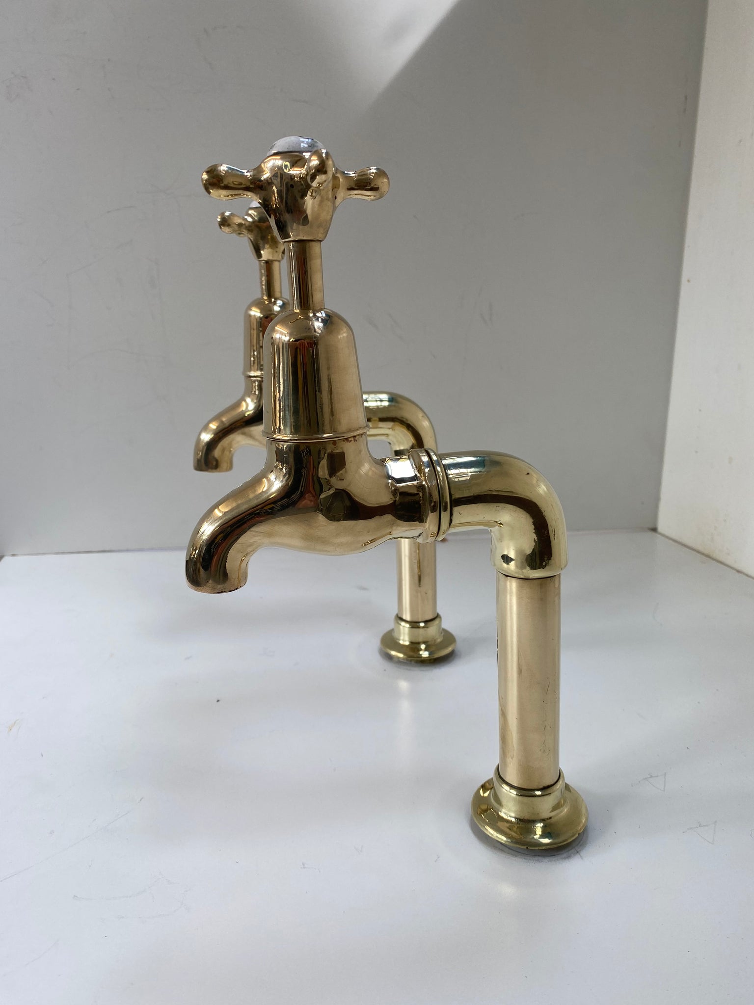 Large Edwardian 3/4" Bib Taps on Pedestals suitable for Larger Kitchen Sinks C.1920 in Unsealed Polished Brass finish.