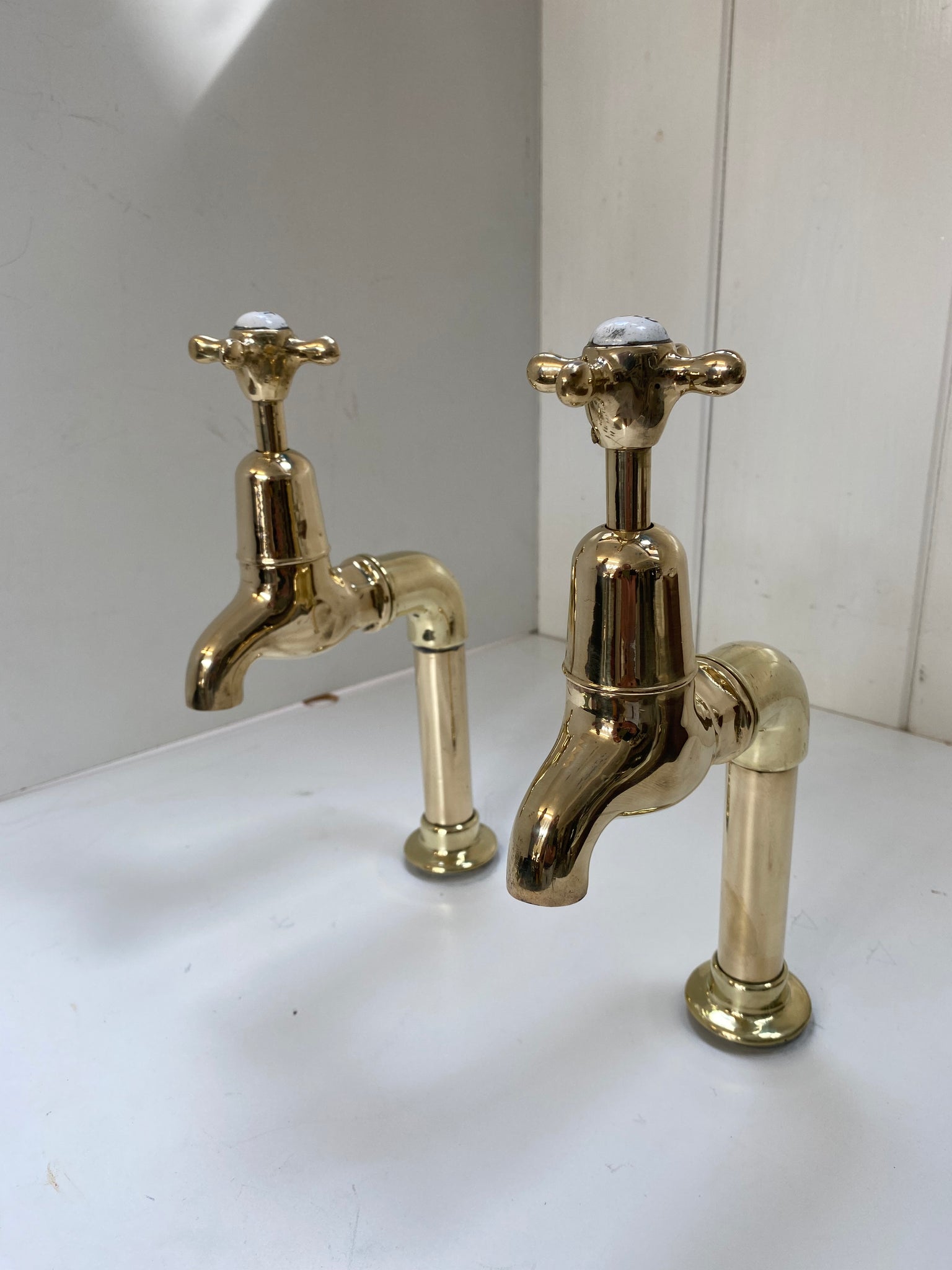 Large Edwardian 3/4" Bib Taps on Pedestals suitable for Larger Kitchen Sinks C.1920 in Unsealed Polished Brass finish.