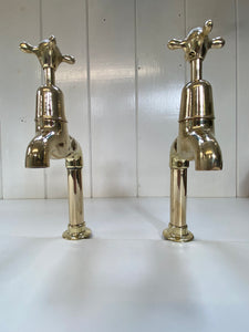 Large Edwardian 3/4" Bib Taps on Pedestals suitable for Larger Kitchen Sinks C.1920 in Unsealed Polished Brass finish.