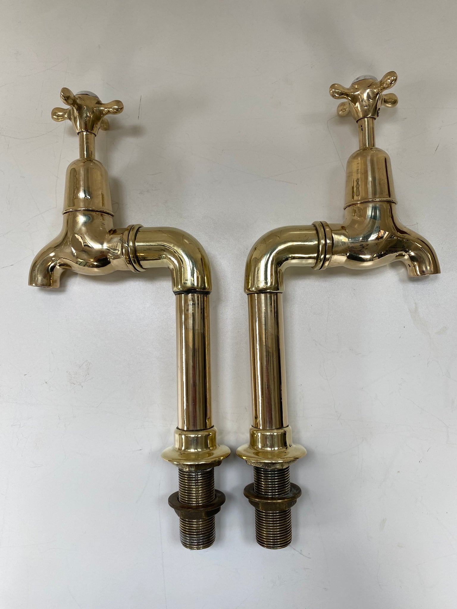 Large Edwardian 3/4" Bib Taps on Pedestals suitable for Larger Kitchen Sinks C.1920 in Unsealed Polished Brass finish.